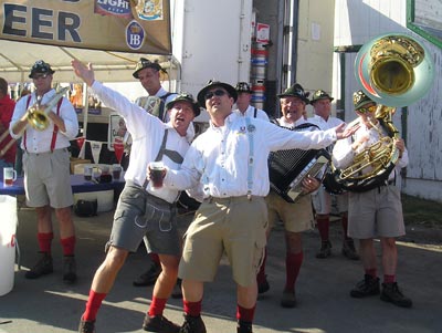 Oktoberfest band with tuba, trombone, accordion and cowbell