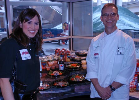Cleveland Clinic Wellness Manager Kristin Kirkpatrick and Executive Chef Jim Perko flank some new healthy choice food options at Progressive Field