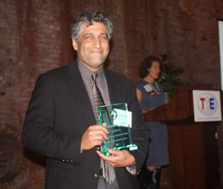 Bahman Taheri of Alphamicron with award