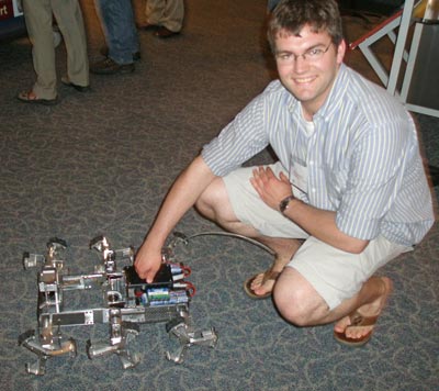 Philip Dunker with Lunar exploration vehicle concept robot that has a laser sensor on front 