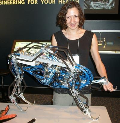 Nicole Kern of CWRU with robot based on a greyhound