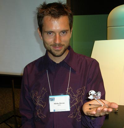 Mirko Kovac of EPFL (Ecole Polytechnique Fdrale de Lausanne) in Switzerland with his self-deploying microglider robot.  Based on a cricket, the robot jumps more than 27 times its body size.