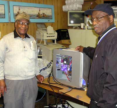 Calvin Simmons and Ken Eskridge with Cal's new system
