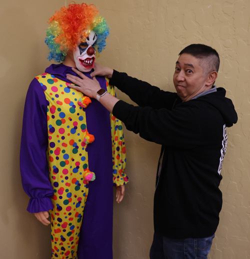 Johnny Wu choking a clown 