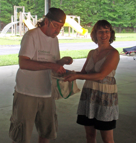 Andy Craze draws a raffle ticket from Heidi Hooper