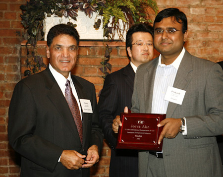 Monte Ahuja awards Electron Database Corp.