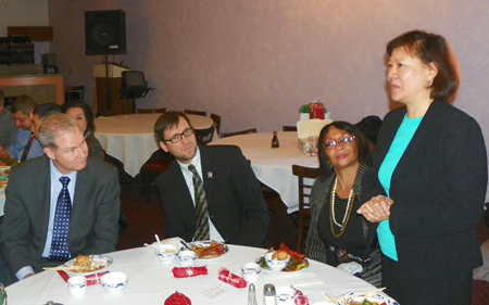 Dan Walsh, Brian Cummins and Mamie Mitchell listen to Judy Wong from Margaret W. Wong & Associates