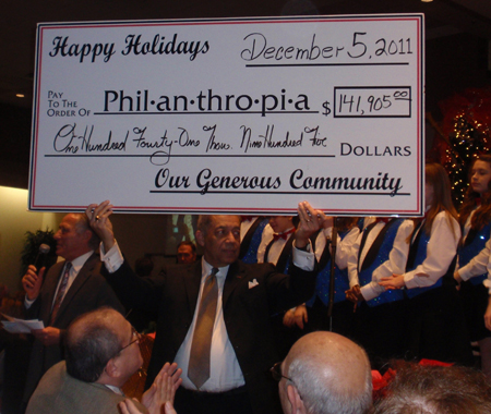 Leon Bibb holing Philanthropia check