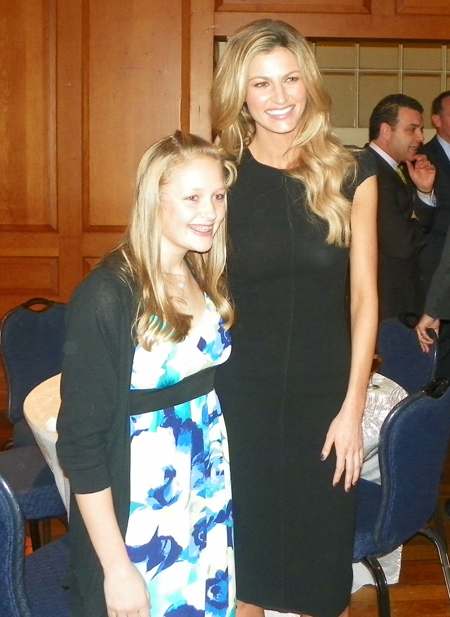 ESPN reporter Erin Andrews posing with a fan