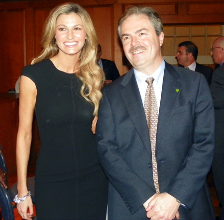 ESPN reporter Erin Andrews posing with a fan