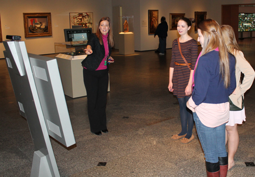 Caroline Guscott, Communications Manager of the Cleveland Museum of Art, shows some young visitors how to do virtual sculpting 