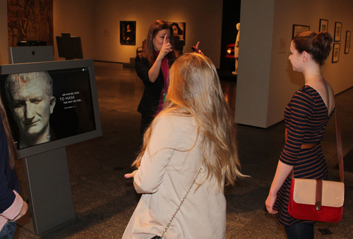 Caroline Guscott, Communications Manager of the Cleveland Museum of Art, shows some young visitors how to do virtual sculpting 