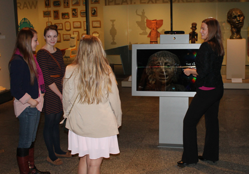 Caroline Guscott, Communications Manager of the Cleveland Museum of Art, shows some young visitors how to do virtual sculpting 