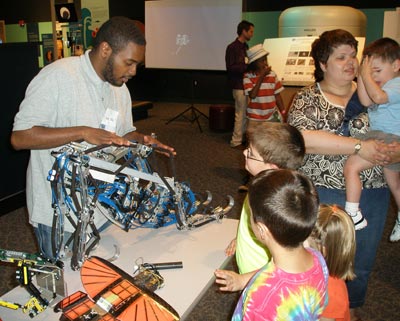 Brian Taylor showing robots to kids