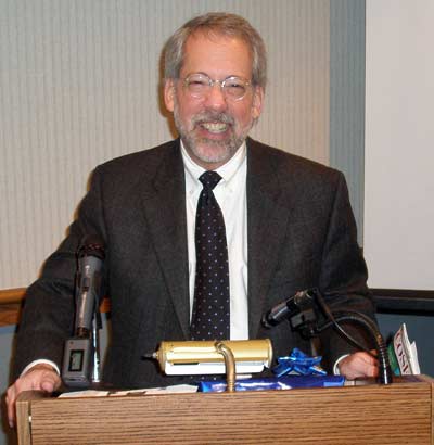 Bruce Hennes at the podium